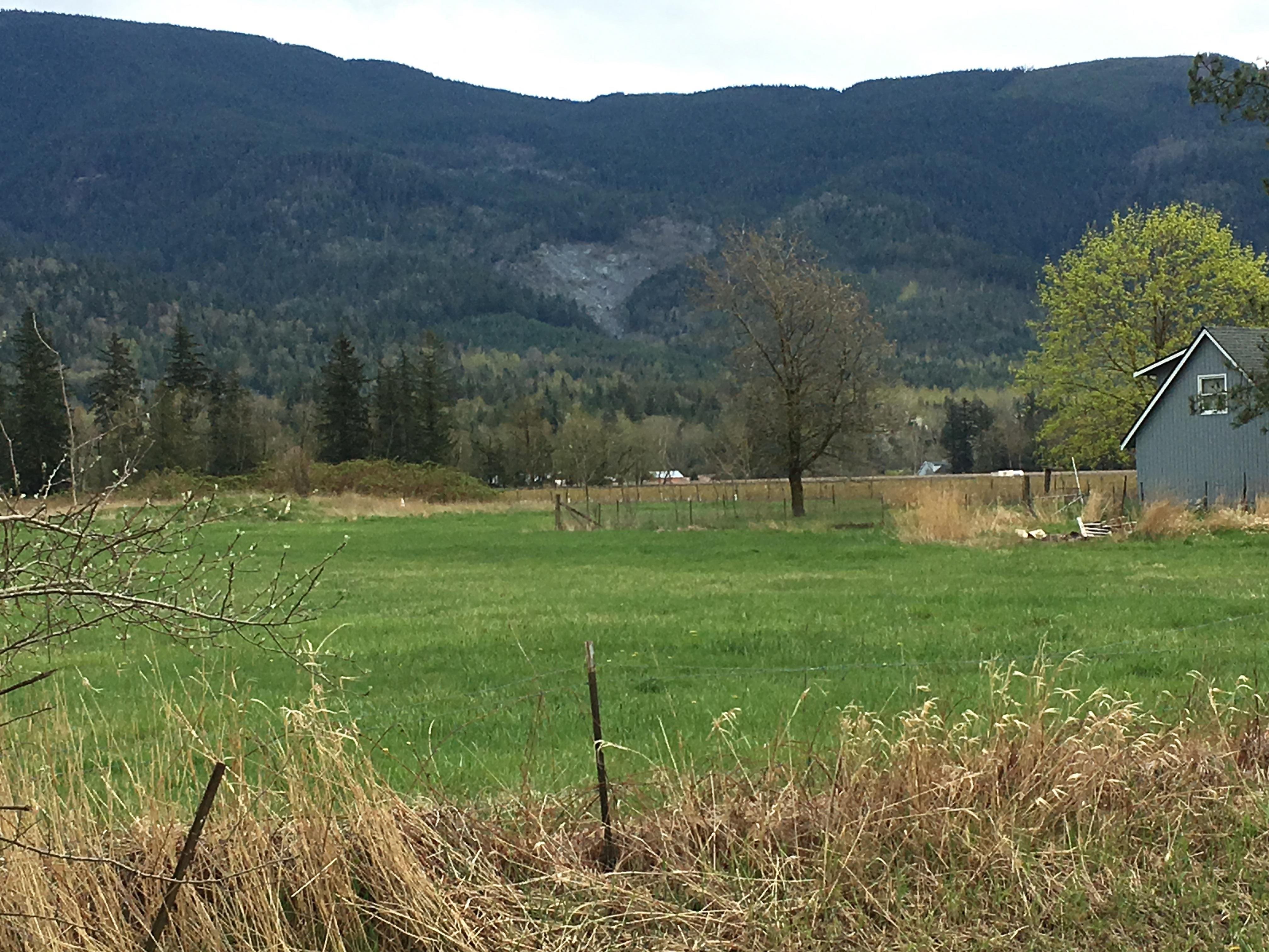 Exposed earth in landslide area above farmland