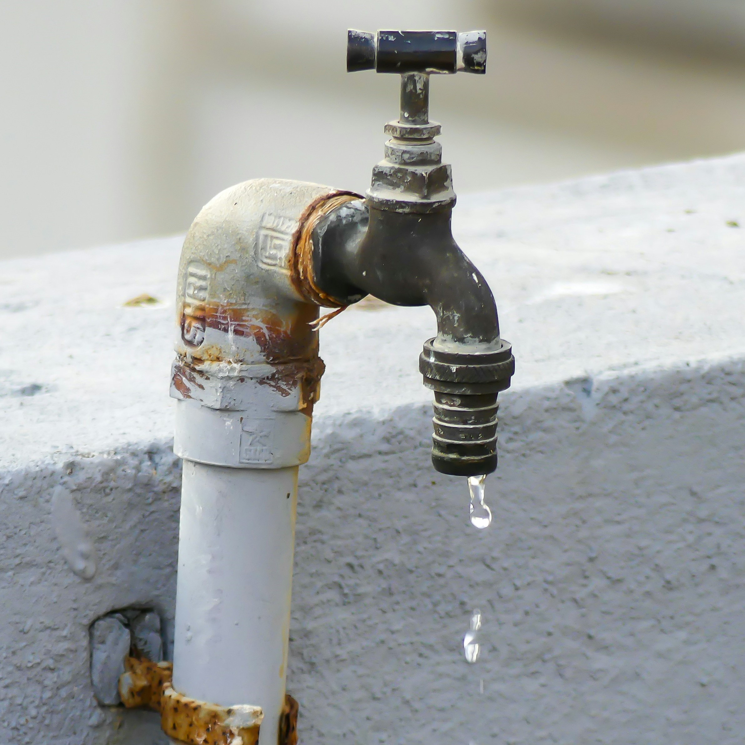 Outdoor faucet with water dripping