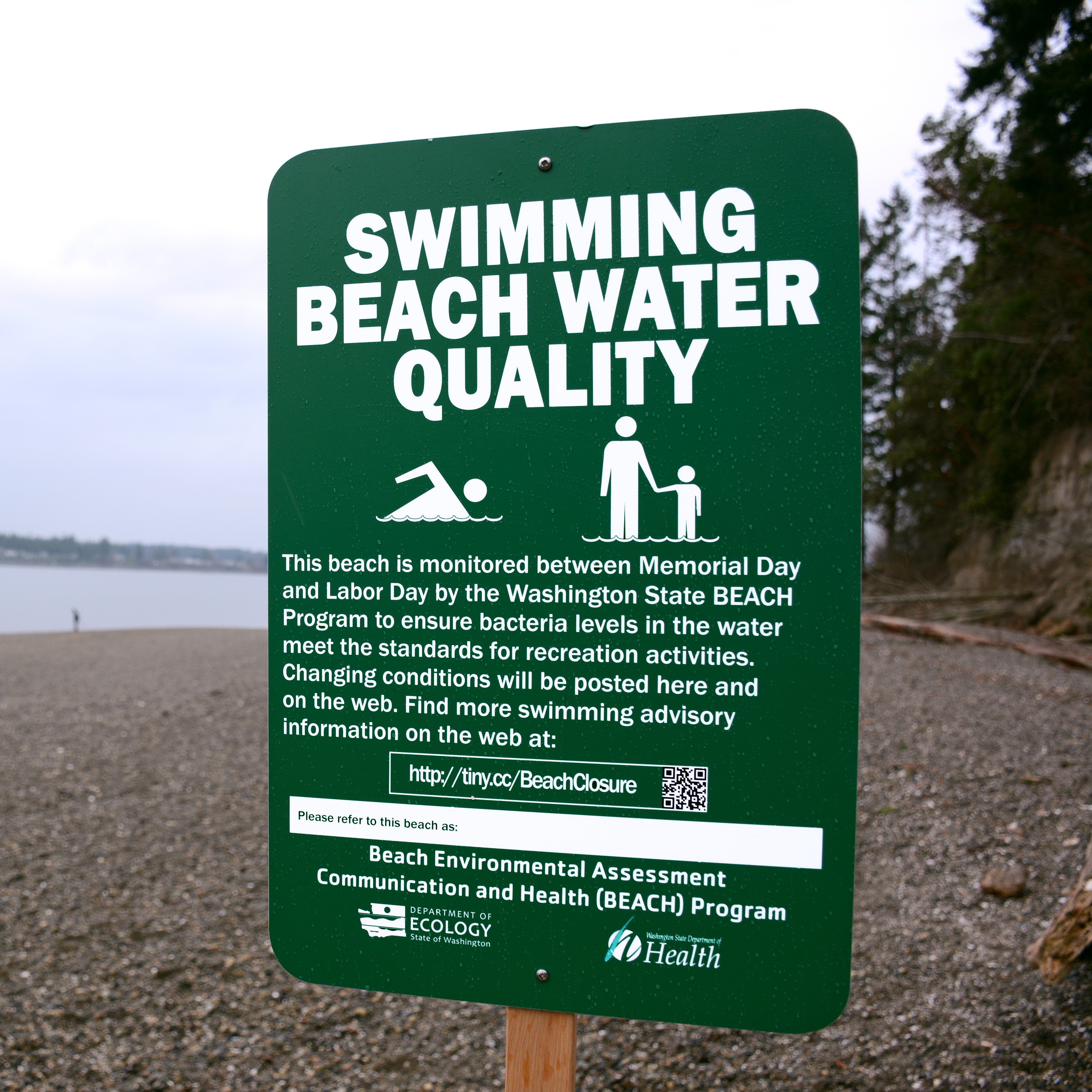 Sign that reads Swimming Beach Water Quality