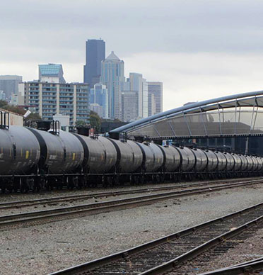 An oil train passing through downtown Seattle.