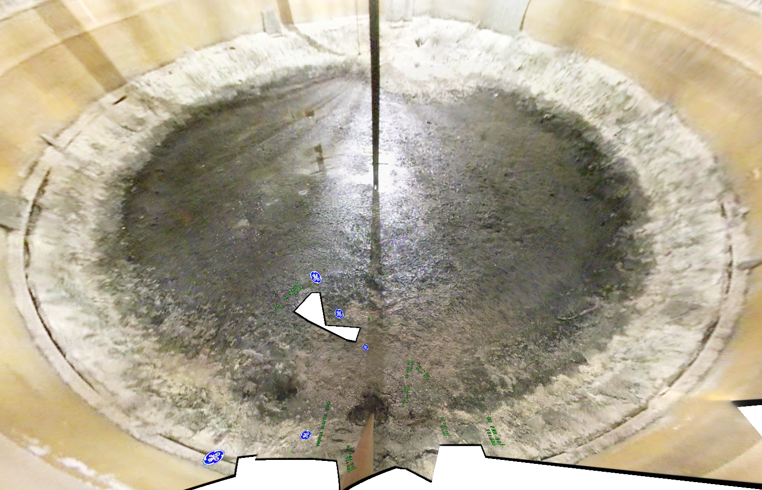 Dark brown sludge sitting on bottom of mostly empty tank