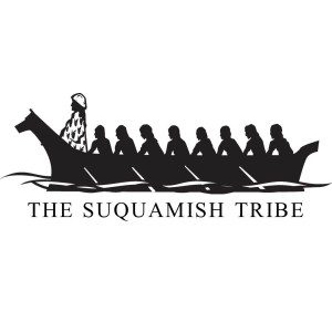 Suquamish Tribe logo, canoe rowed by 8 people, one standing in front